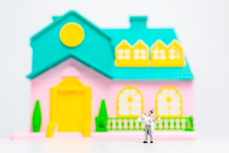 Miniature people , Couple standing together in front of their house, valentines day conceptの写真素材