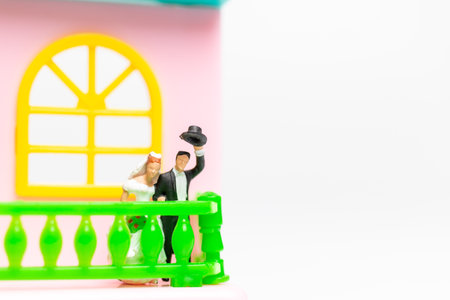 Miniature people , Couple standing together in front of their house, valentines day conceptの写真素材