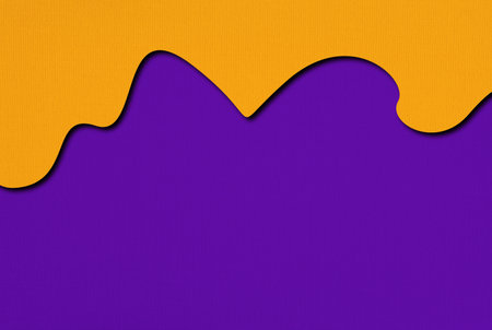 Abstract dripping orange and purple background with bold Halloween colors and texture.の写真素材