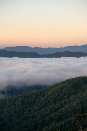 Beautiful morning view of Huay Kub Kab village in Chiang Mai, Thailand, surrounded by misty...