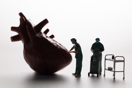Conceptual image of miniature surgeons performing heart surgery on an anatomical heart model,...