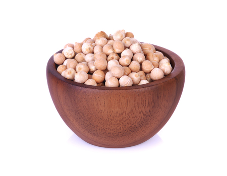 Dried chickpeas in wooden bowl on white background.の写真素材