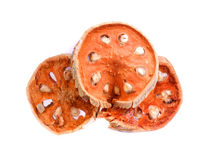 Dry Bael slices fruit isolated in white background. Dry herb for healthy beverage.の写真素材