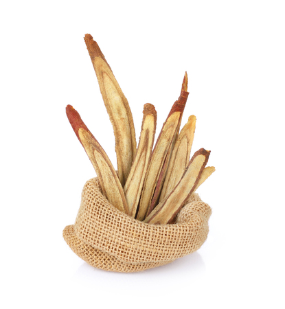 dried Liquorice roots on a white backgroundの写真素材