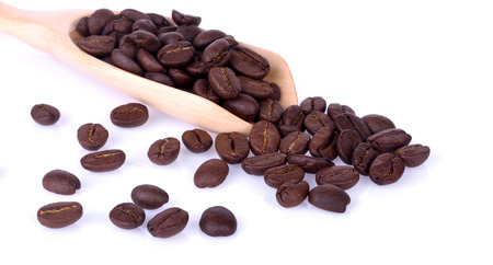 coffee bean in wooden spoon on white backgroundの写真素材