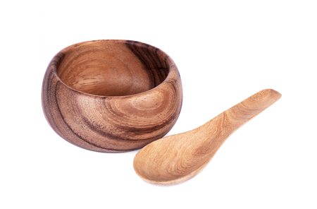 wooden bowl and spoon isolated on white background.の写真素材