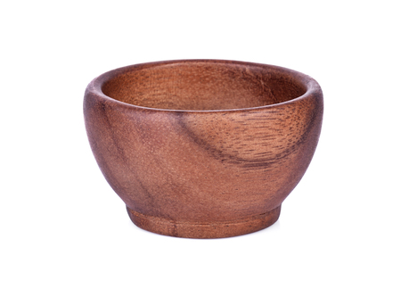 wooden bowl isolated on white backgroundの写真素材