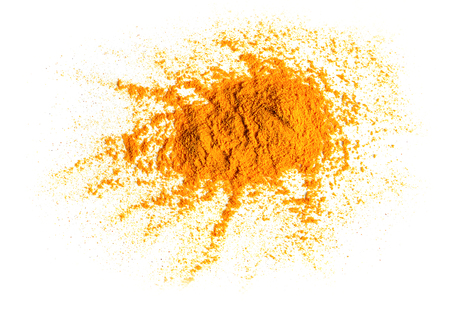 Turmeric (Curcuma) powder pile isolated on white background, top viewの写真素材