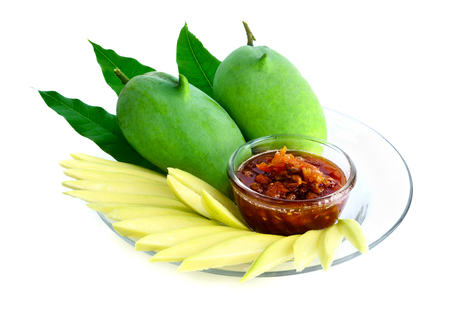 Raw mangoes sour with Sweet fish sauce "nampla wan", thai food on white backgroundの写真素材