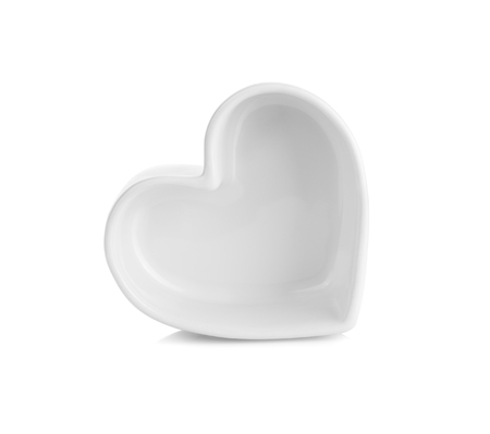 white heart shaped ceramic bowls isolated on white backgroundの写真素材