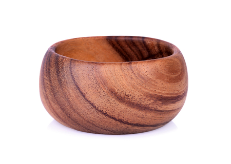 wooden bowl isolated on white background.の写真素材