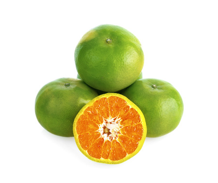 green tangerine isolated on white backgroundの写真素材