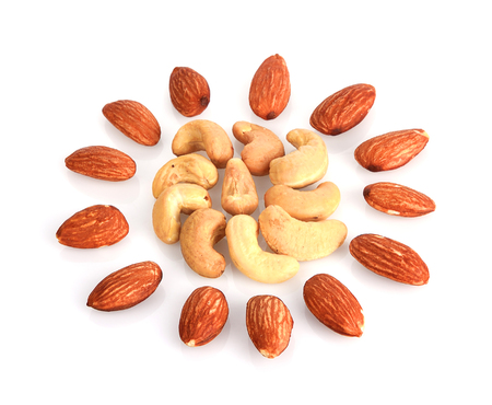 Almonds and cashews nut on a white backgroundの写真素材