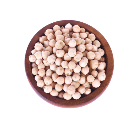 uncooked chickpeas in wooden bowl on white background.の写真素材