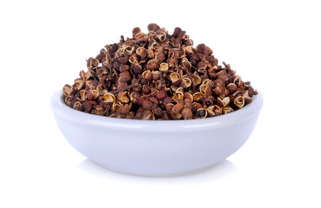 Dry Zanthozylum limonella Alston in white ceramic bowl on white backgroundの写真素材