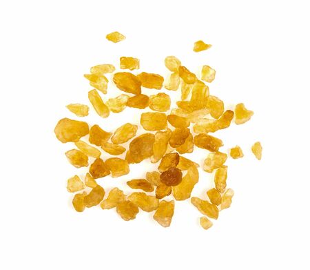 Brown cane sugar isolated on white backgroundの写真素材