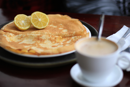 lemon on pancakes white coffeeの写真素材