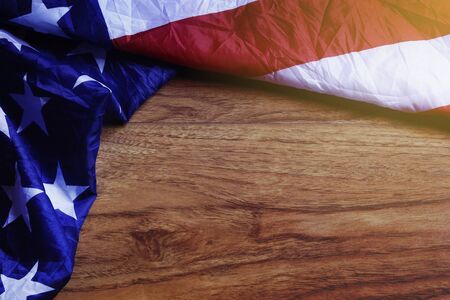 USA Flag on Brown Wooden Board. America Flag Background with Copy Space for MLK Day, President's Day, Patriot Day, 4th of July, Independence Day. の写真素材