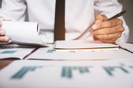 Businessman is analyzing the company budget.の写真素材