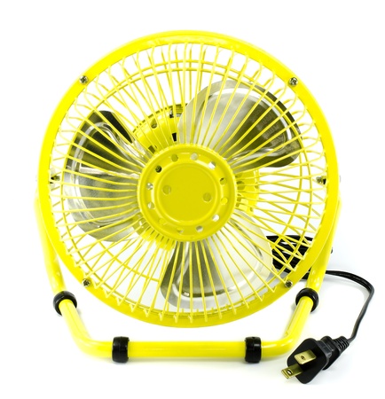 Yellow electric fan with white isolate background の写真素材