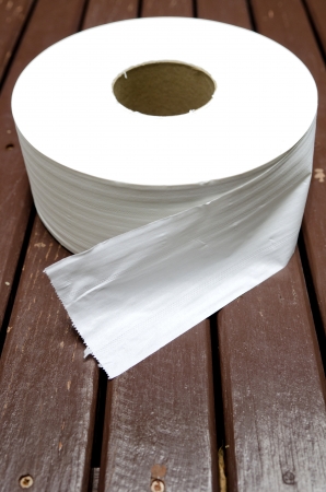 white tissues roll on brown wood tableの写真素材