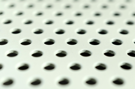 white seamless circle perforated metal grill pattern の写真素材