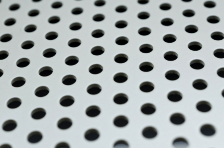 seamless circle perforated metal grill pattern の写真素材