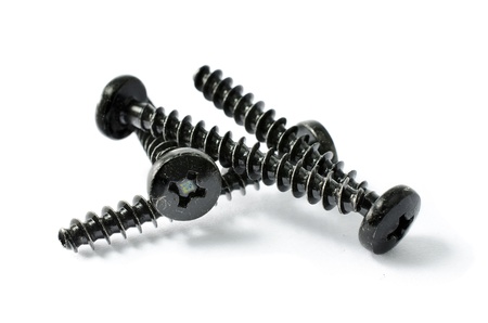Black Screws white isolate background の写真素材