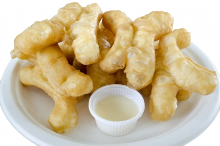 deep-fried doughstick  and  sweetened condensed milk  Thailand sweets   with isolate white backgroundの写真素材