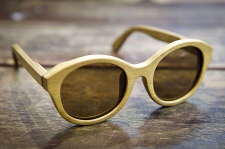 vintage wood sunglass on wood backgroundの写真素材