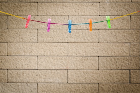 clothespins on rainbow rope with modern wall background   の写真素材