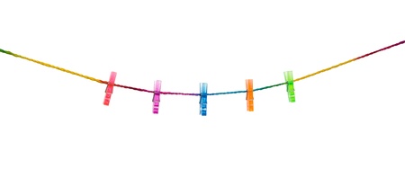 Clothespins on raimbow rope with modern wall background   の写真素材