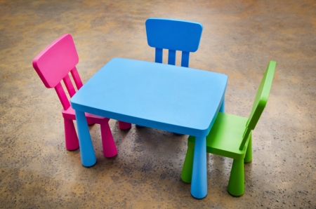 Table and three chairs on concrete floor for Kindergarten Preschool Classroomの写真素材