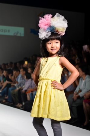 THAILAND, BANGKOK- OCT 2013 : A model walks the runway at the Ginger Snaps New Collection 2013 at Kids Internation Fashion Week 2013 during 5-6 october, 2013 in Bangkok,Thailandのeditorial素材