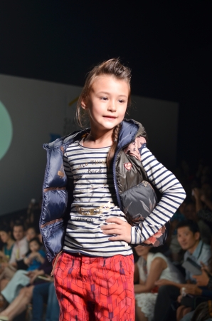 THAILAND, BANGKOK- OCT 2013 : A model walks the runway at the Kids 21 New Collection 2013 at Kids Internation Fashion Week 2013 during 5-6 october, 2013 in Bangkok,Thailandのeditorial素材
