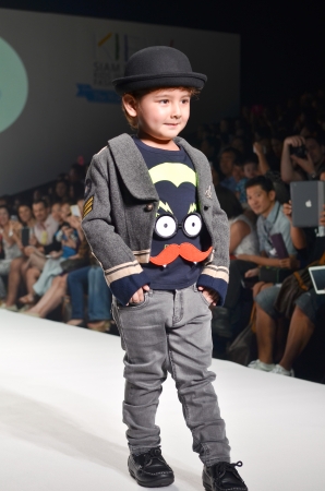 THAILAND, BANGKOK- OCT 2013 : A model walks the runway at the Kids 21 New Collection 2013 at Kids Internation Fashion Week 2013 during 5-6 october, 2013 in Bangkok,Thailandのeditorial素材