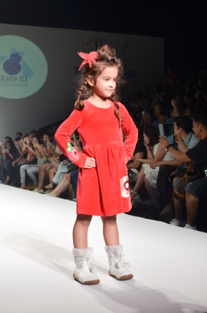 THAILAND, BANGKOK- OCT 2013 : A model walks the runway at the Kids 21 New Collection 2013 at Kids Internation Fashion Week 2013 during 5-6 october, 2013 in Bangkok,Thailandのeditorial素材