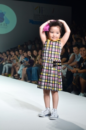 THAILAND, BANGKOK- OCT 2013 : A model walks the runway at the Kids 21 New Collection 2013 at Kids Internation Fashion Week 2013 during 5-6 october, 2013 in Bangkok,Thailandのeditorial素材