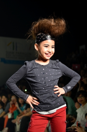 THAILAND, BANGKOK- OCT 2013 : A model walks the runway at the IKKS New Collection 2013 at Kids Internation Fashion Week 2013 during 5-6 october, 2013 in Bangkok,Thailandのeditorial素材
