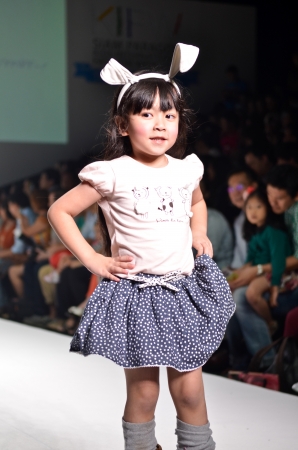 THAILAND, BANGKOK- OCT 2013 : A model walks the runway at the LE PETIT PUMM New Collection 2013 at Kids Internation Fashion Week 2013 during 5-6 october, 2013 in Bangkok,Thailandのeditorial素材