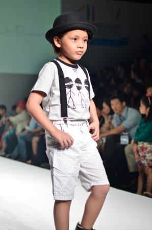THAILAND, BANGKOK- OCT 2013 : A model walks the runway at the LE PETIT PUMM New Collection 2013 at Kids Internation Fashion Week 2013 during 5-6 october, 2013 in Bangkok,Thailandのeditorial素材