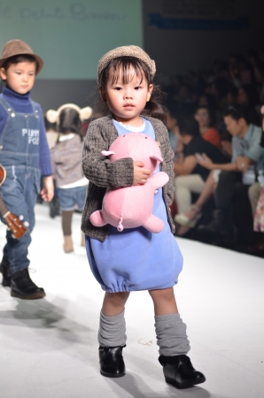 THAILAND, BANGKOK- OCT 2013 : A model walks the runway at the LE PETIT PUMM New Collection 2013 at Kids Internation Fashion Week 2013 during 5-6 october, 2013 in Bangkok,Thailandのeditorial素材