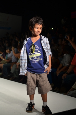 THAILAND, BANGKOK- OCT 2013   A model walks the runway at the PUMPKIN PATCH New Collection 2013 at Kids Internation Fashion Week 2013 during 5-6 october, 2013 in Bangkok,Thailandのeditorial素材