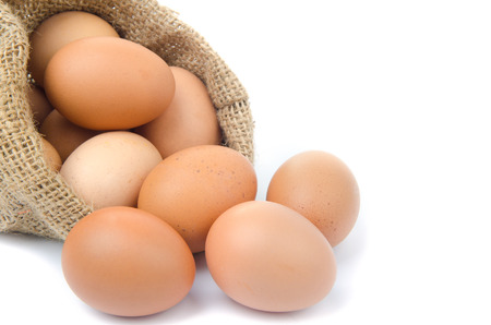 eggs with gunny bag isolated on white backgroundの写真素材