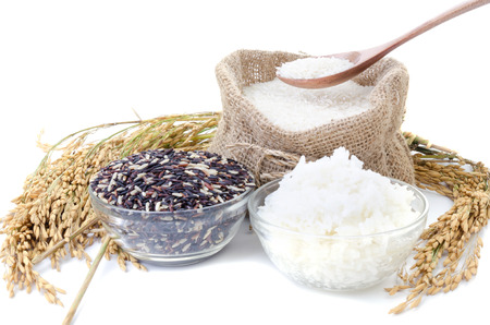 Raw rice, Selection Of black rice white rice and white steamed rice with wood spoon . の写真素材