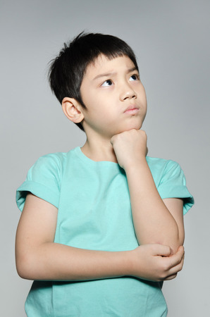Portrade Of asian cute boy on gray background . の写真素材