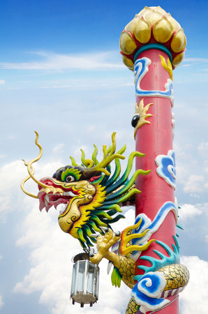 Chinese style dragon statue in temple with blue sky . の写真素材
