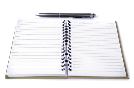 Lined notebook and pen on white background . 