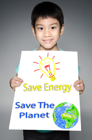 Portrait of Asian child with Eco concept on gray backgroundの写真素材