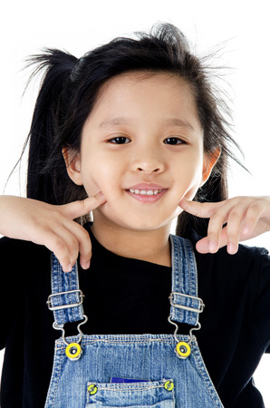 Portrait of Little asian smile Girl on white background .の写真素材